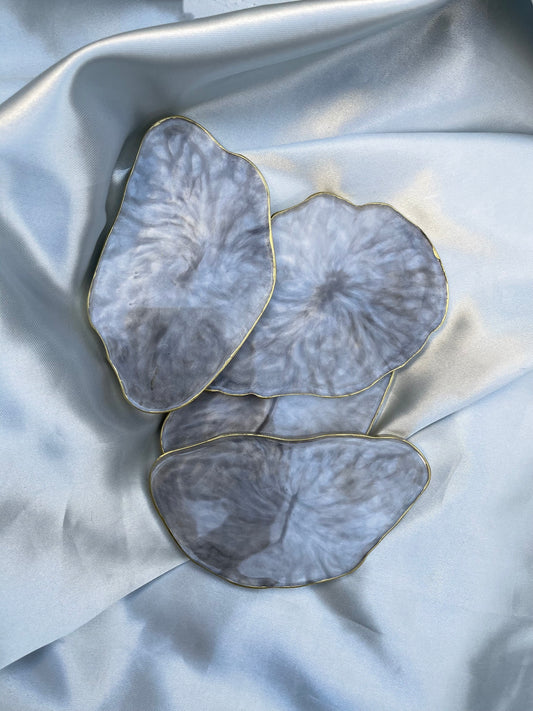 Coasters tipo mármol c/ orilla dorada. (4 piezas)